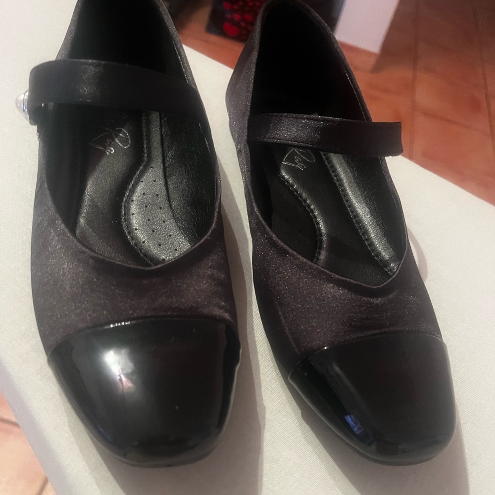 Emi and flat black shoes.